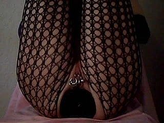 Lady with huge dildo encircling ass